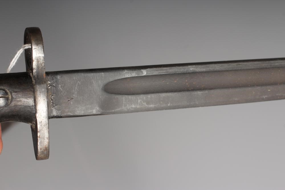 A RARE OWEN SMG BAYONET with 10" blade, two piece wood grip stamped "SLAZ44" and leather scabbard Image