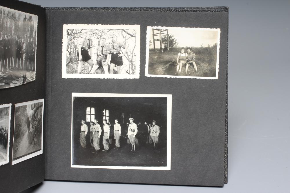 A HITLER YOUTH PHOTO ALBUM, containing 50 original images from the pre-war and war time period (Est. Image