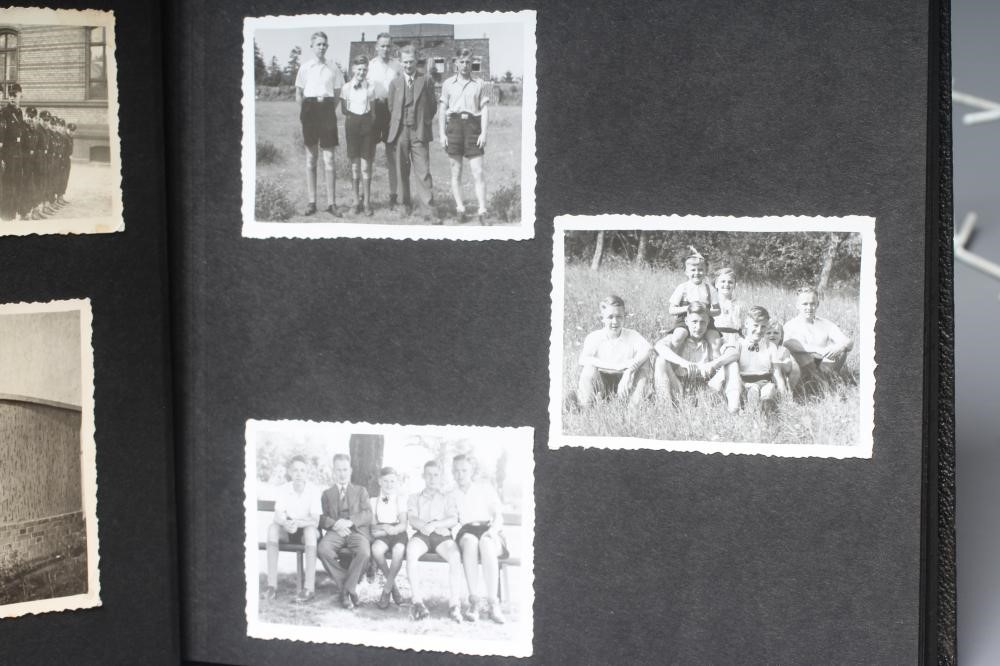 A HITLER YOUTH PHOTO ALBUM, containing 50 original images from the pre-war and war time period (Est. Image