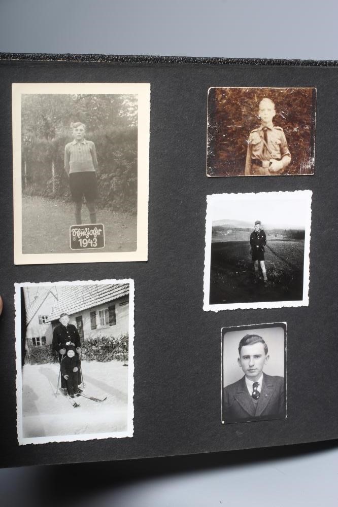 A HITLER YOUTH PHOTO ALBUM, containing 50 original images from the pre-war and war time period (Est. Image