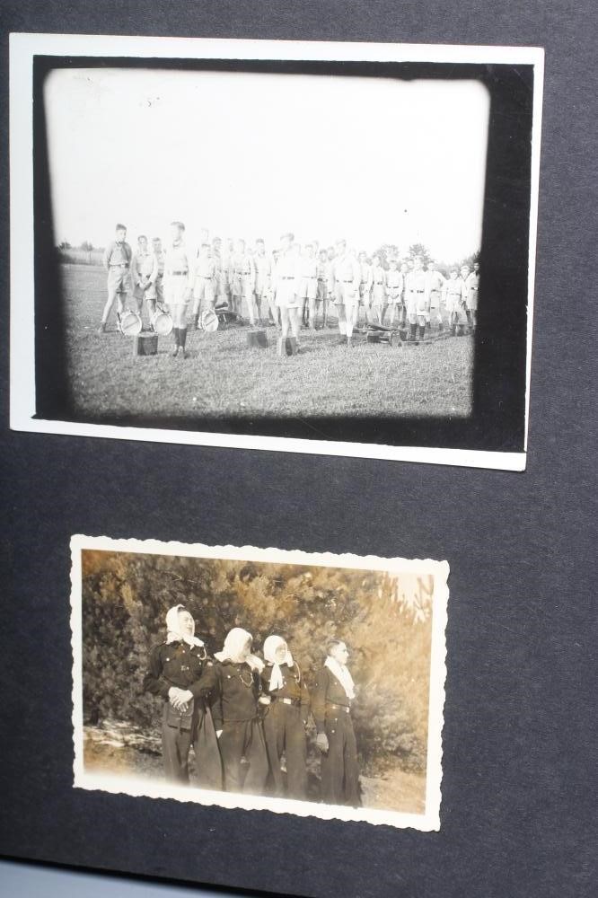 A HITLER YOUTH PHOTO ALBUM, containing 50 original images from the pre-war and war time period (Est. Image