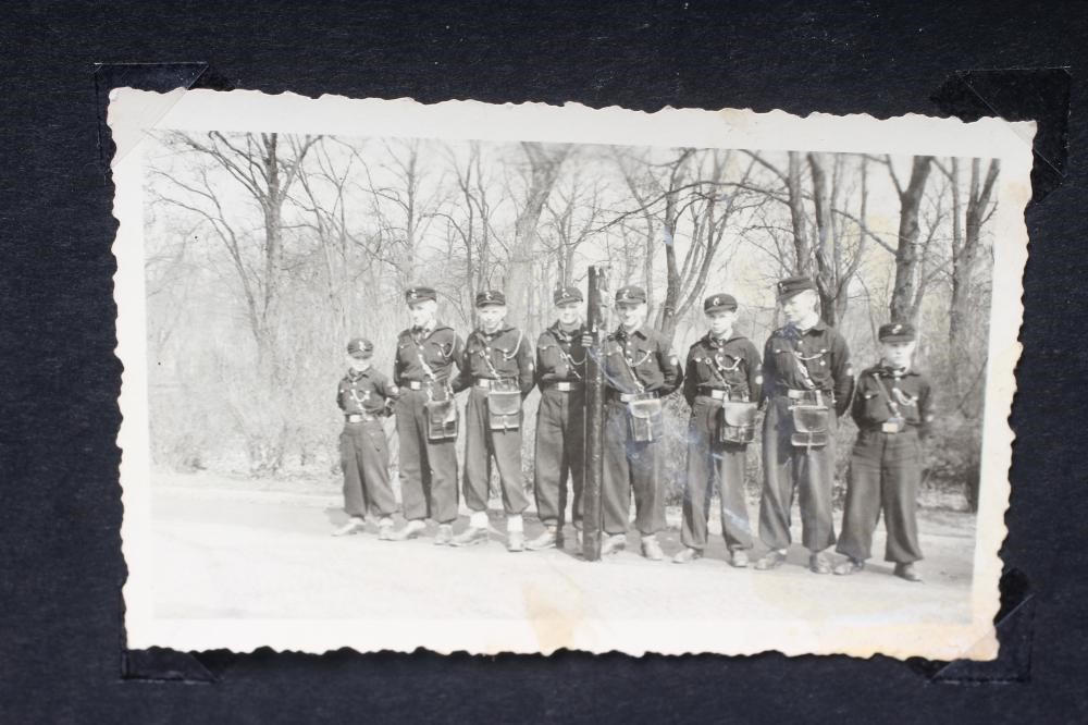 A HITLER YOUTH PHOTO ALBUM, containing 50 original images from the pre-war and war time period (Est. Image