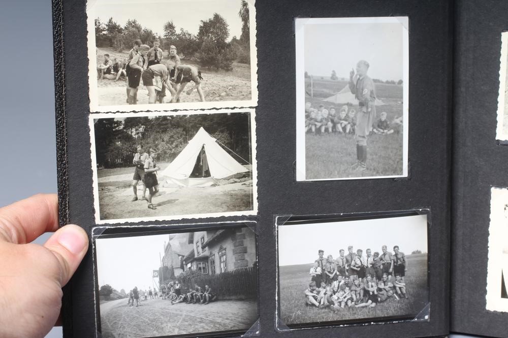 A HITLER YOUTH PHOTO ALBUM, containing 50 original images from the pre-war and war time period (Est. Image