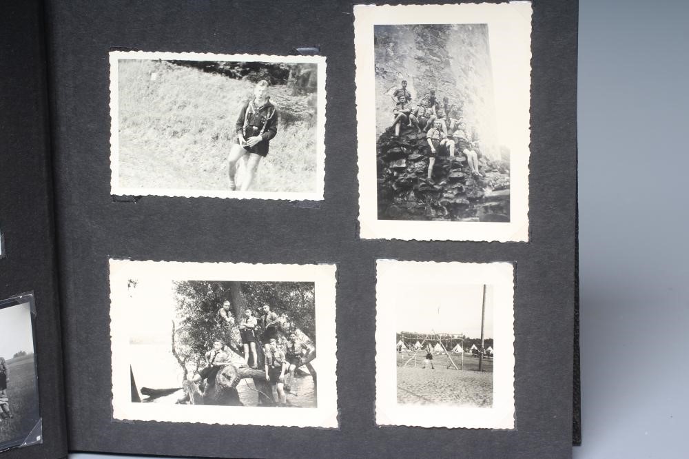 A HITLER YOUTH PHOTO ALBUM, containing 50 original images from the pre-war and war time period (Est. Image
