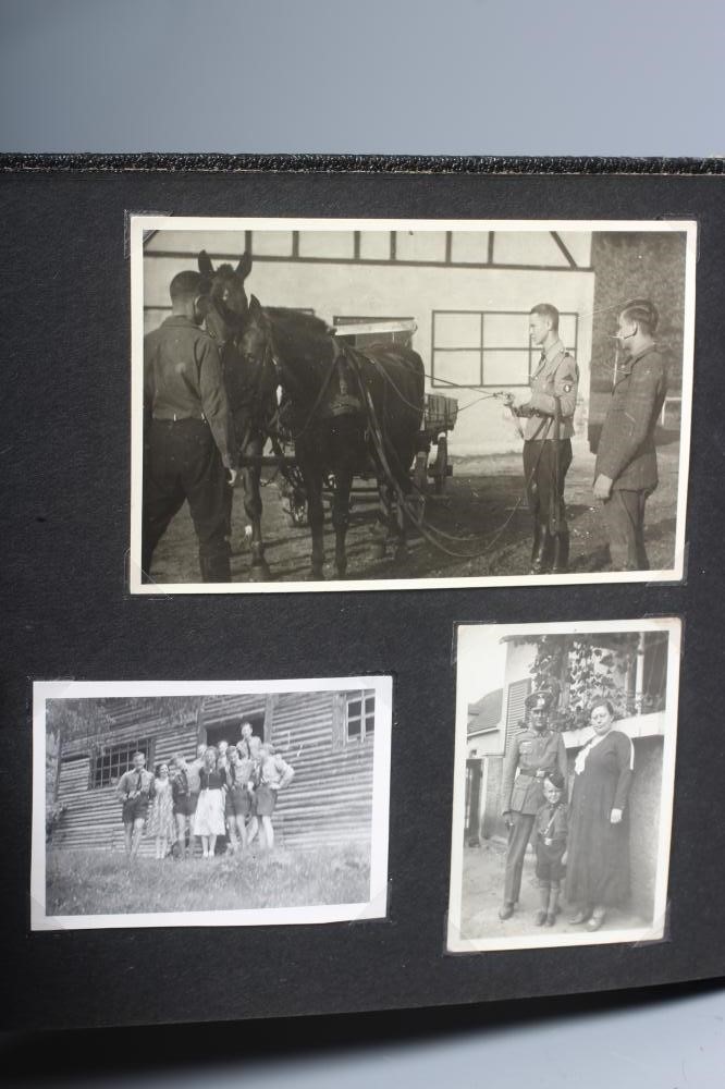 A HITLER YOUTH PHOTO ALBUM, containing 50 original images from the pre-war and war time period (Est. Image
