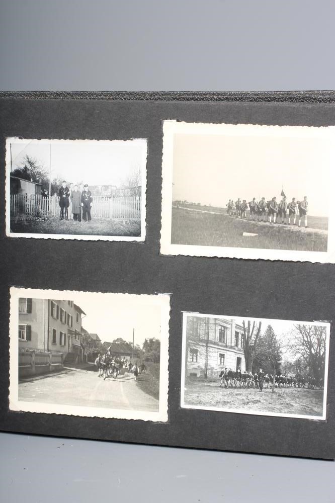 A HITLER YOUTH PHOTO ALBUM, containing 50 original images from the pre-war and war time period (Est. Image