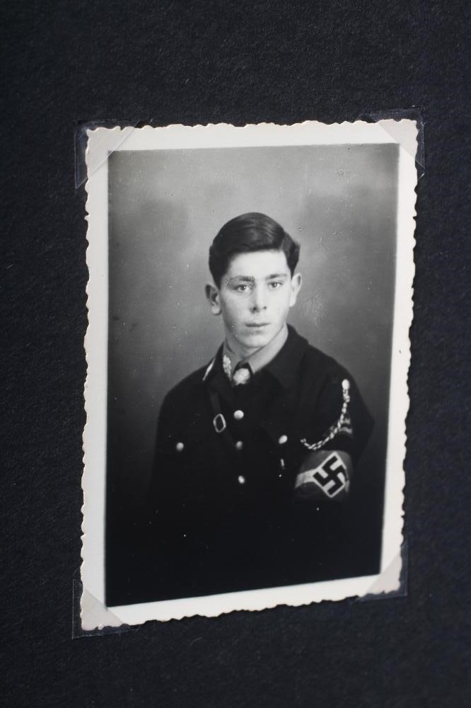 A HITLER YOUTH PHOTO ALBUM, containing 50 original images from the pre-war and war time period (Est. Image