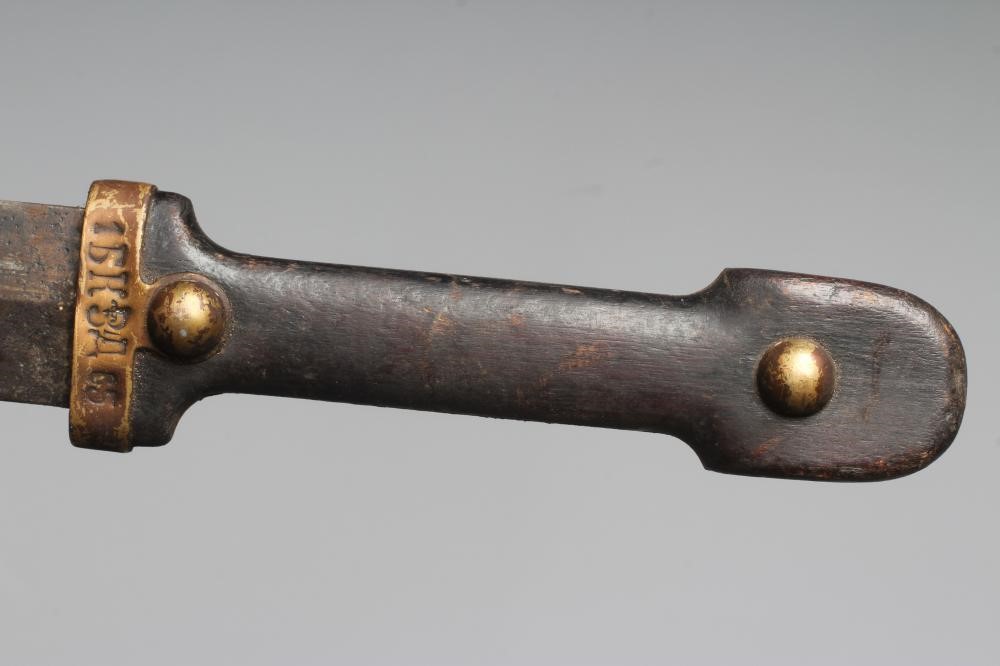 AN IMPERIAL RUSSIAN KINGAL DAGGER, the 17 1/8" curved blade with double fullers, wooden hilt and Image