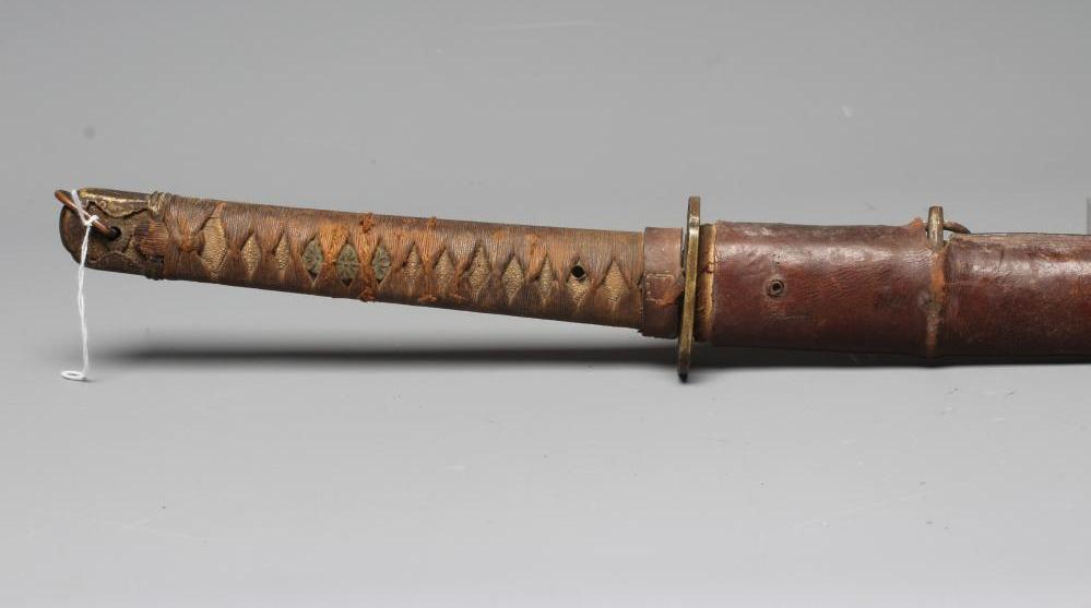 A JAPANESE WAKAZASHI with 23 1/2" blade, signed tang, Second World War mounts and leather saya, 36" Image