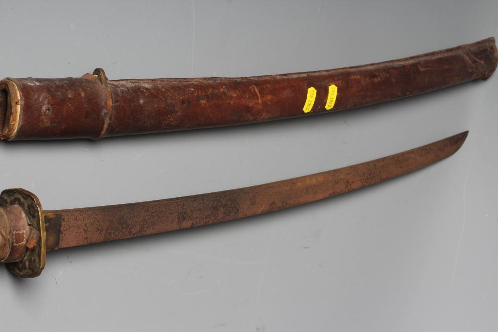 A JAPANESE WAKAZASHI with 23 1/2" blade, signed tang, Second World War mounts and leather saya, 36" Image
