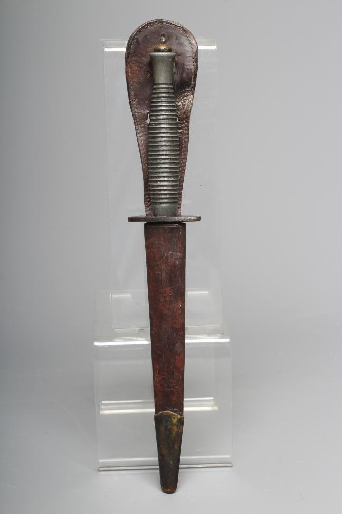 A FAIRBAIRN & SYKES COMMANDO DAGGER with 6 3/4" blade, cross guard stamped ENGLAND, ribbed grip Image