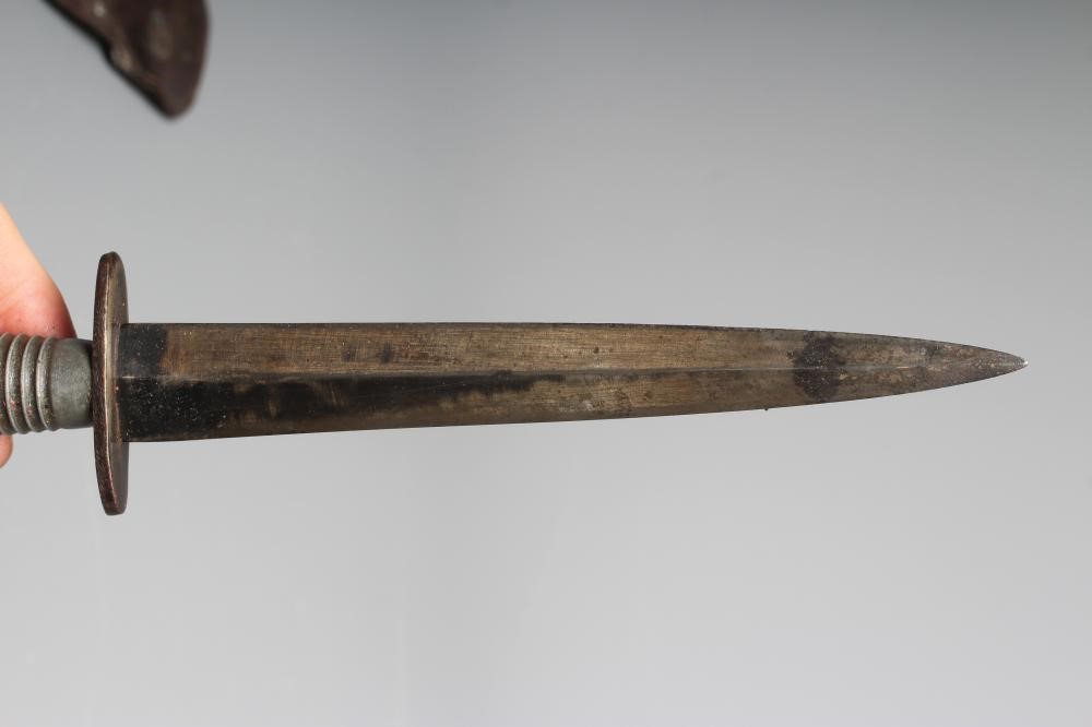 A FAIRBAIRN & SYKES COMMANDO DAGGER with 6 3/4" blade, cross guard stamped ENGLAND, ribbed grip Image