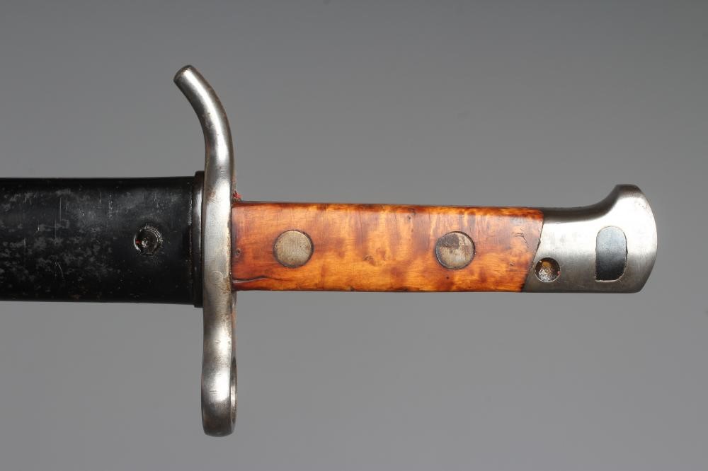 A FINNISH 1935 PATTERN BAYONET by Fiskars, with 11 3/4" blade, maple grips, S stamped to cross guard Image
