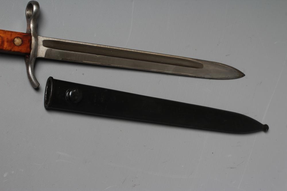A FINNISH 1935 PATTERN BAYONET by Fiskars, with 11 3/4" blade, maple grips, S stamped to cross guard Image