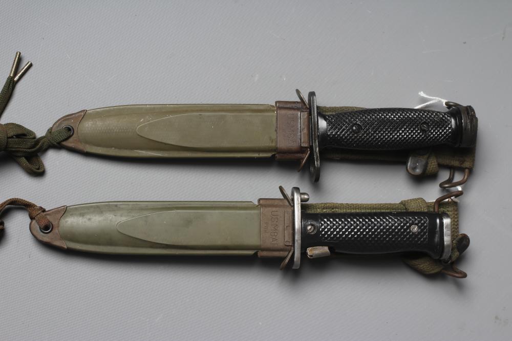 TWO US M8A1 BAYONETS, MK4 and M5A1 patterns, both with plastic scabbards and canvas frogs, each 13" Image