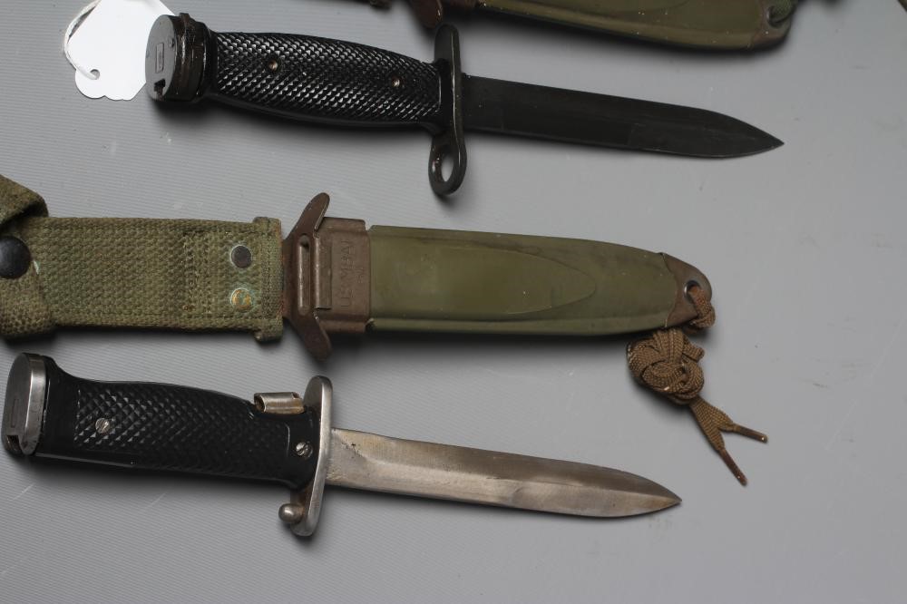 TWO US M8A1 BAYONETS, MK4 and M5A1 patterns, both with plastic scabbards and canvas frogs, each 13" Image