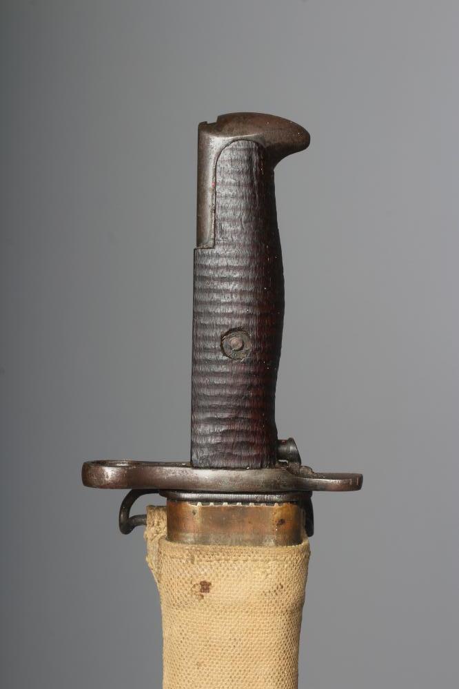A US 1905 PATTERN SPRINGFIELD BAYONET with canvas scabbard Image