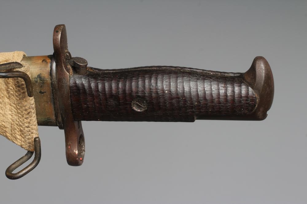 A US 1905 PATTERN SPRINGFIELD BAYONET with canvas scabbard Image