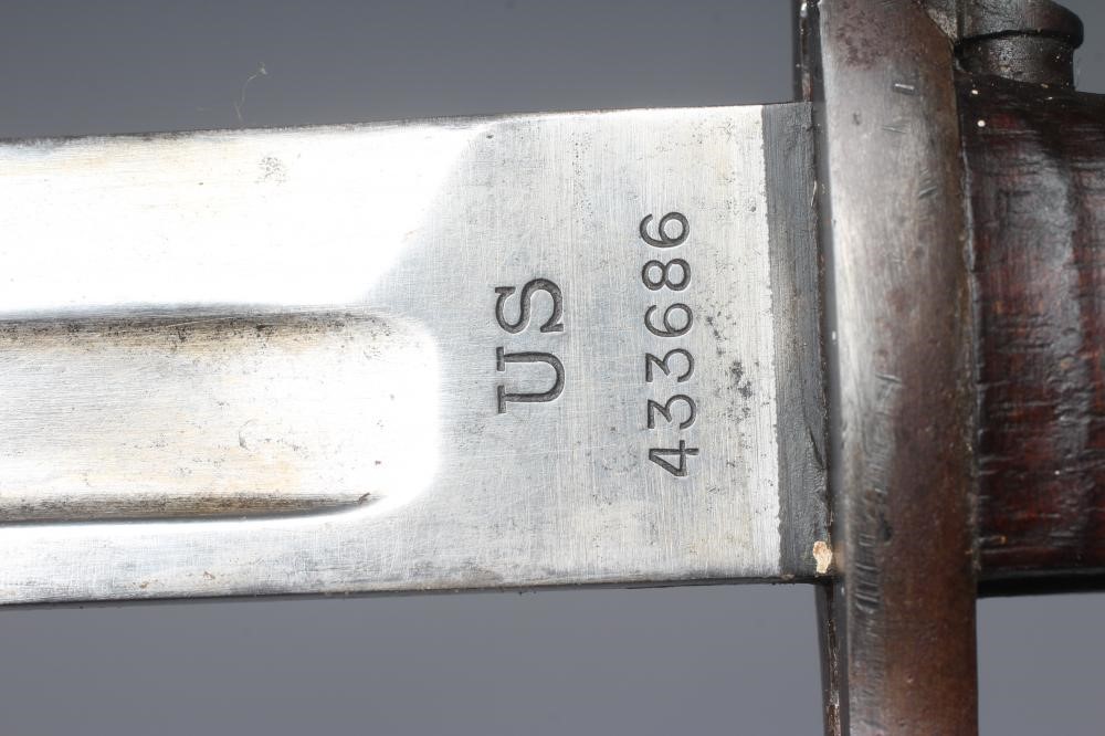A US 1905 PATTERN SPRINGFIELD BAYONET with canvas scabbard Image