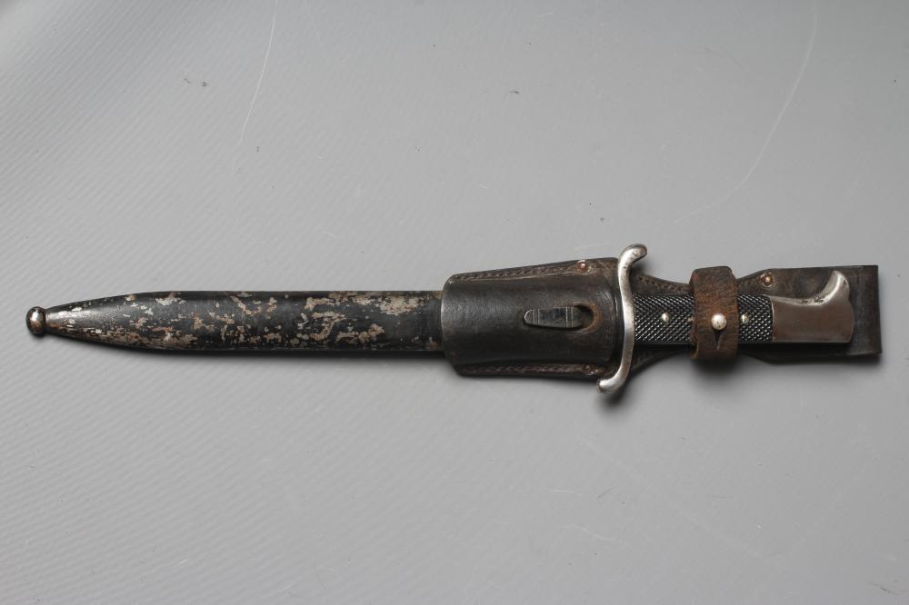 A GERMAN FIRE SERVICE DRESS BAYONET with 9 3/4" blade, serpentine hand guard, steel scabbard and Image