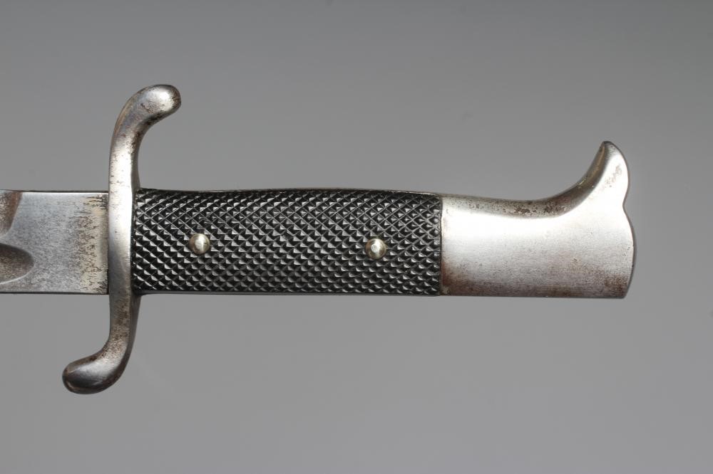 A GERMAN FIRE SERVICE DRESS BAYONET with 9 3/4" blade, serpentine hand guard, steel scabbard and Image
