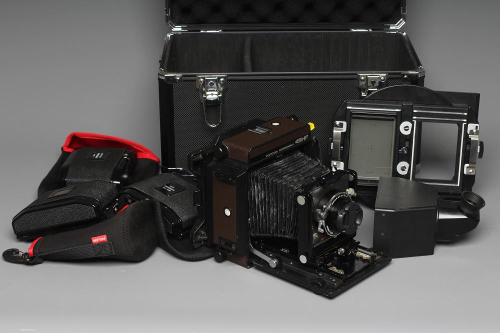 A TOPCON HORSEMAN 45HF CAMERA with a Super Topcor 1:56 f=150mm lens, rotary back, viewer and black Image