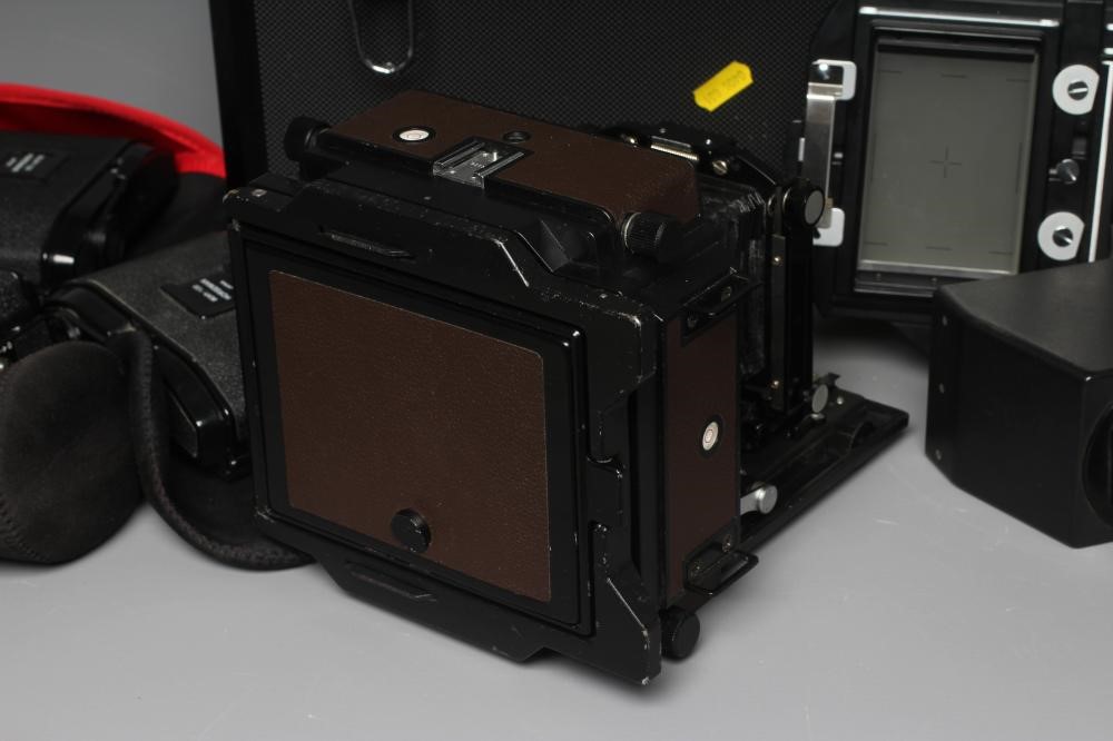 A TOPCON HORSEMAN 45HF CAMERA with a Super Topcor 1:56 f=150mm lens, rotary back, viewer and black Image
