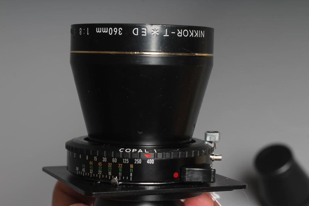 A NIKON NIKKOR-T ED 360MM 1:8 LENS numbered up to 720mm, with lens cap, 360mm rear lens and 500mm Image