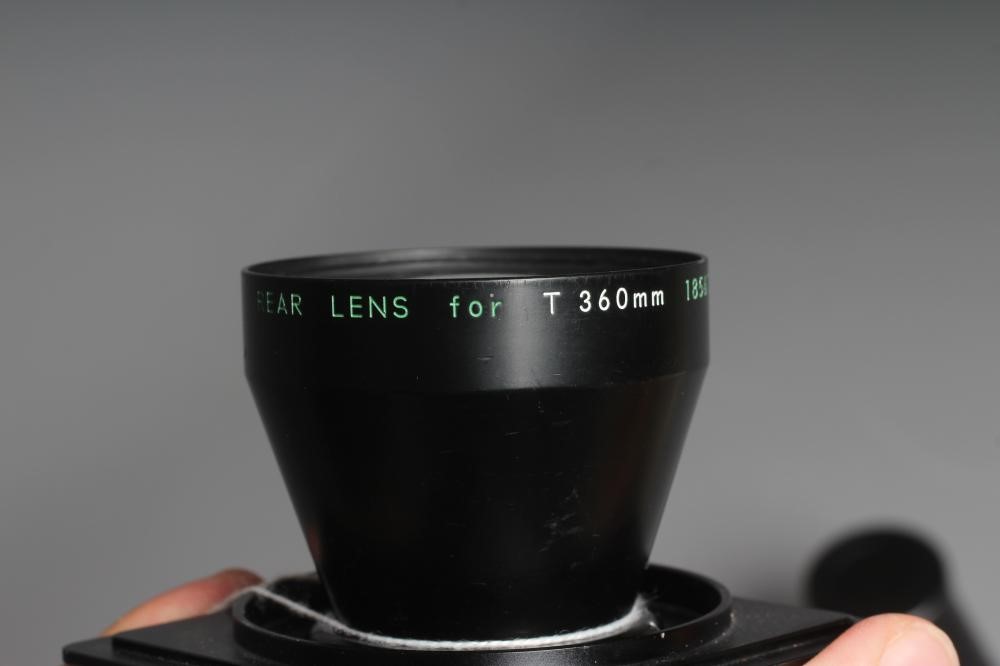 A NIKON NIKKOR-T ED 360MM 1:8 LENS numbered up to 720mm, with lens cap, 360mm rear lens and 500mm Image
