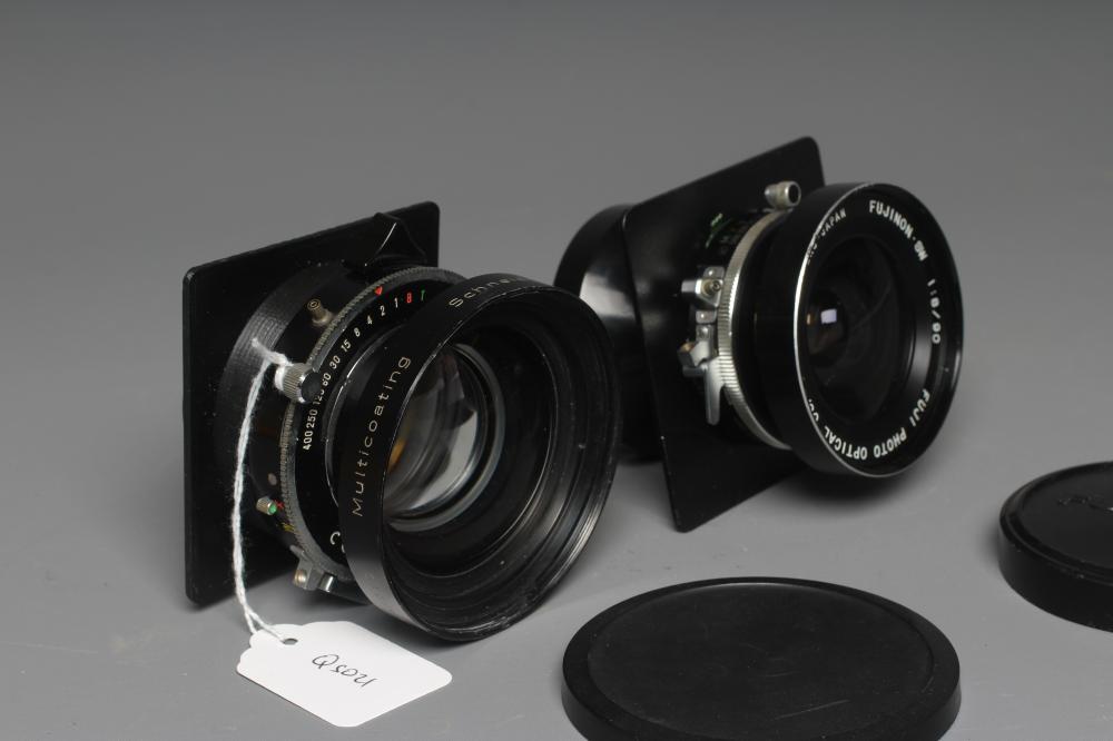 TWO CAMERA LENSES, comprising a Copal No.1 Symmar-S 5,6/210 lens, and a Fujinon SW 1:8/90 lens (Est. Image