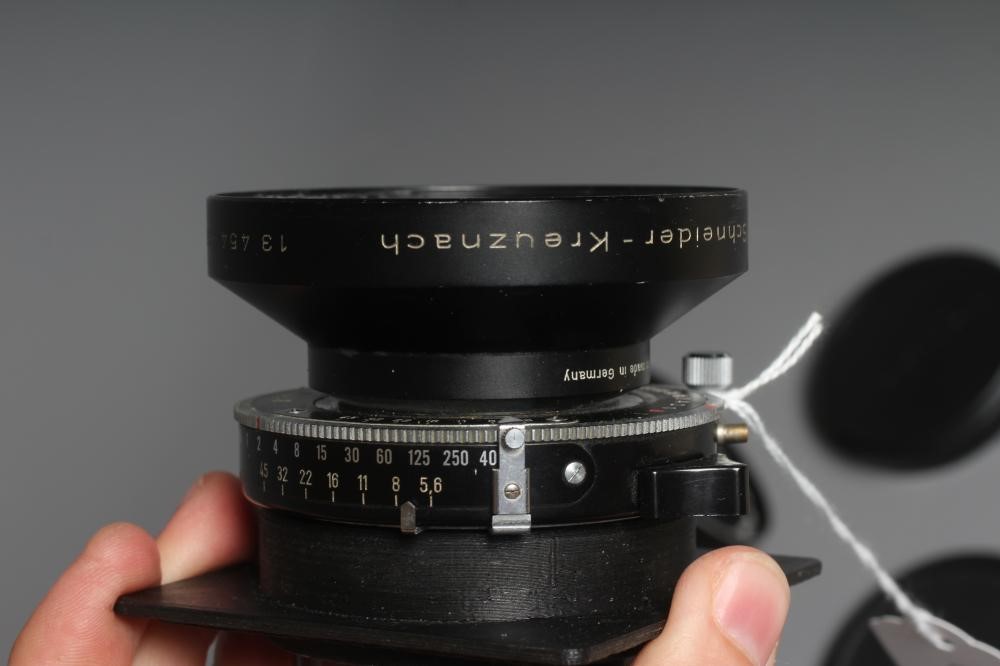 TWO CAMERA LENSES, comprising a Copal No.1 Symmar-S 5,6/210 lens, and a Fujinon SW 1:8/90 lens (Est. Image