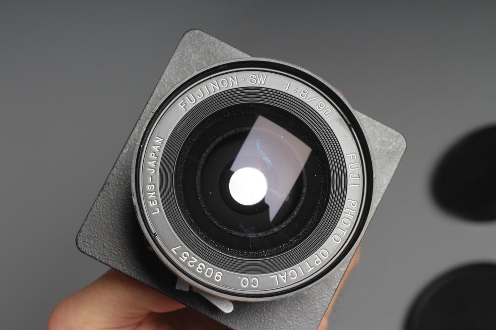 TWO CAMERA LENSES, comprising a Copal No.1 Symmar-S 5,6/210 lens, and a Fujinon SW 1:8/90 lens (Est. Image