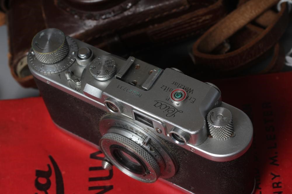 A LEICA CAMERA, no. 263731, with Leitz Elmar f=5cm 1:35 lens, leather case and manual (Est. plus 24% Image