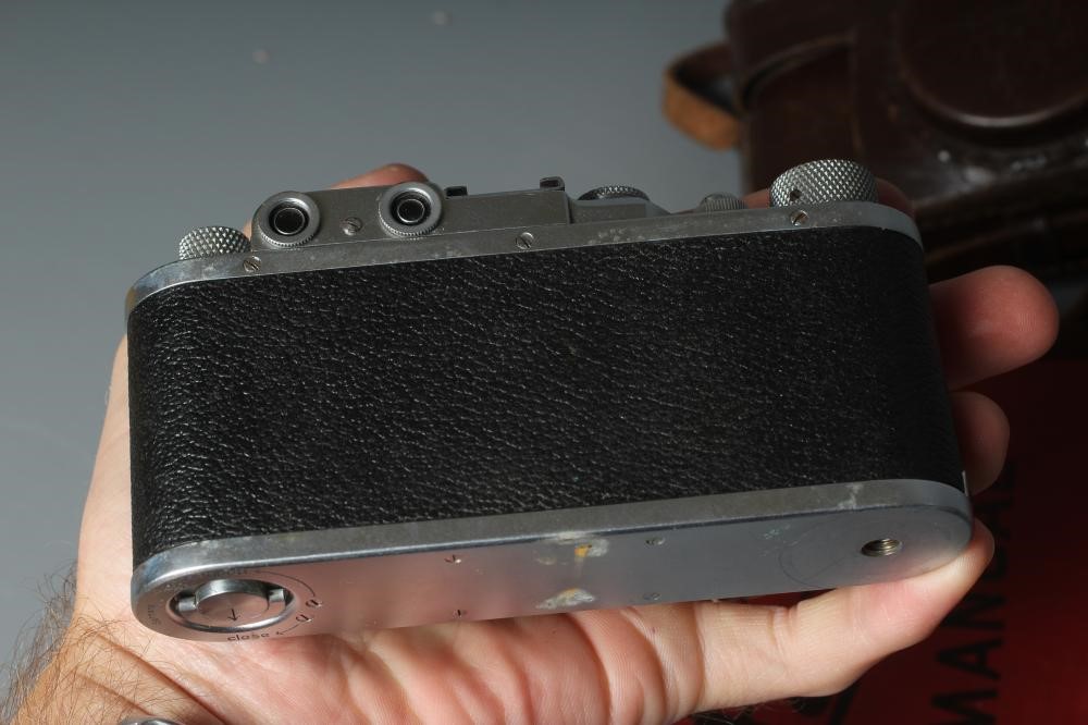 A LEICA CAMERA, no. 263731, with Leitz Elmar f=5cm 1:35 lens, leather case and manual (Est. plus 24% Image