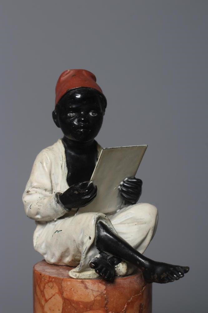 A BERGMAN COLD PAINTED BRONZE ARAB BOY, early 20th century, the boy seated and raised on a column Image