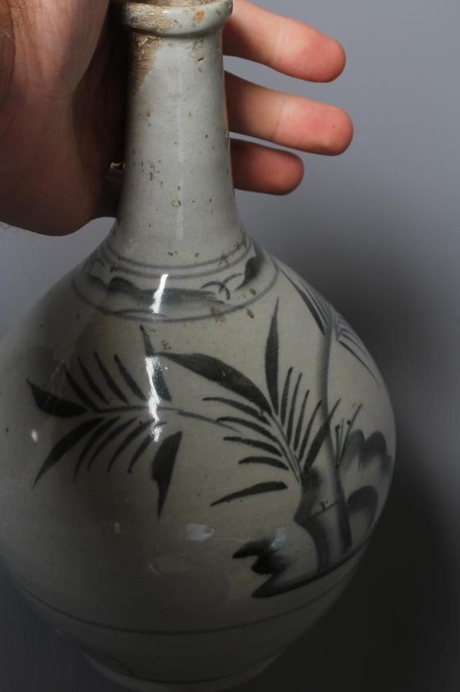 THREE CHINESE STONEWARE BALUSTER VASES, one painted in underglaze blue with stylised bamboo, 10" Image