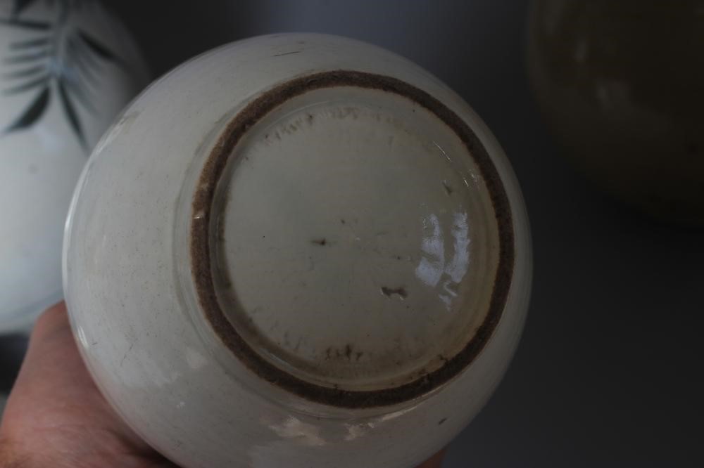 THREE CHINESE STONEWARE BALUSTER VASES, one painted in underglaze blue with stylised bamboo, 10" Image