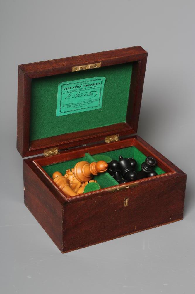A JAQUES STAUNTON CHESS SET, c.1981, in box and ebony, weighted, in green baize lined box with Image