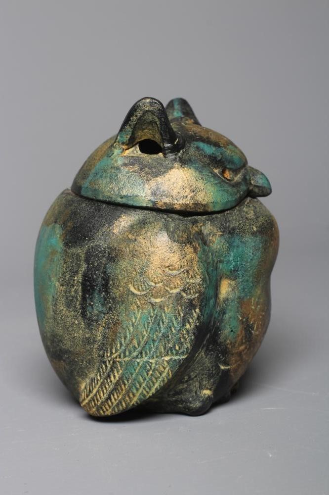 A JAPANESE GREEN PATINATED METAL OWL BOX, modern, the head forming the cover, with gilded Image