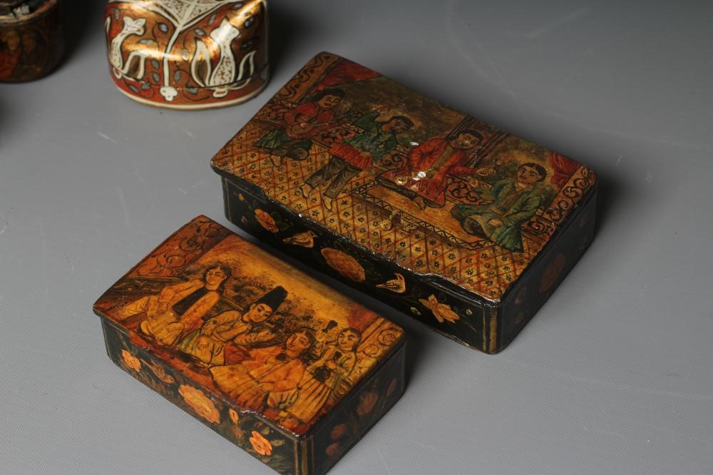 NINE PERSIAN SCHOOL LACQUERED PAPIER MACHE ITEMS comprising two pen boxes Image