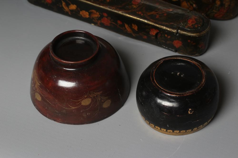 NINE PERSIAN SCHOOL LACQUERED PAPIER MACHE ITEMS comprising two pen boxes Image