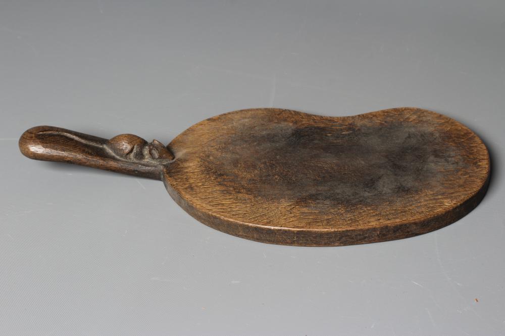 A ROBERT THOMPSON OAK KIDNEY SHAPED CHEESE BOARD, the handle with carved mouse trademark, 14 1/2" Image