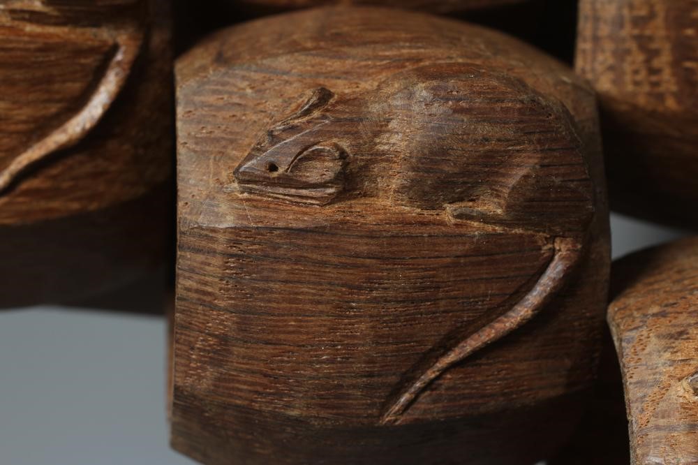 A SET OF SIX ROBERT THOMPSON OCTAGONAL NAPKIN RINGS each with carved mouse trademark, approximately Image