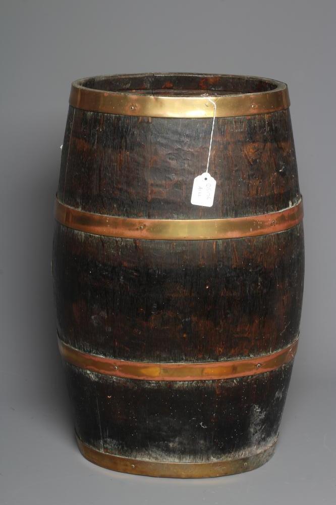 AN OAK COOPERED BARREL, late 19th century, with copper hoops, 24" h x 11" d x 14" w (Est. plus 24% Image