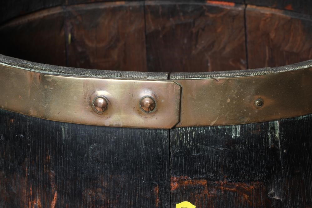 AN OAK COOPERED BARREL, late 19th century, with copper hoops, 24" h x 11" d x 14" w (Est. plus 24% Image