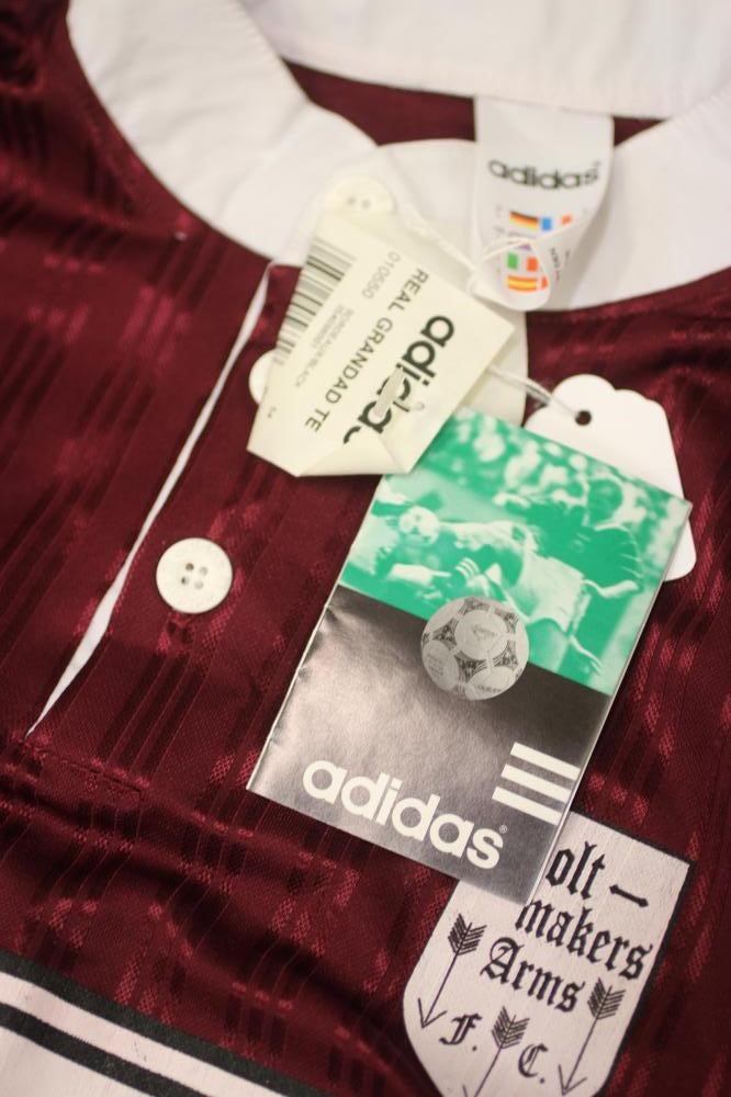 LIAM GALLAGHER - A BESPOKE ADIDAS BOLT MAKERS ARMS PUB FOOTBALL TEAM SHIRT produced when Oasis Image