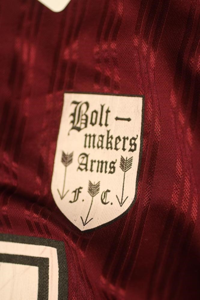 LIAM GALLAGHER - A BESPOKE ADIDAS BOLT MAKERS ARMS PUB FOOTBALL TEAM SHIRT produced when Oasis Image