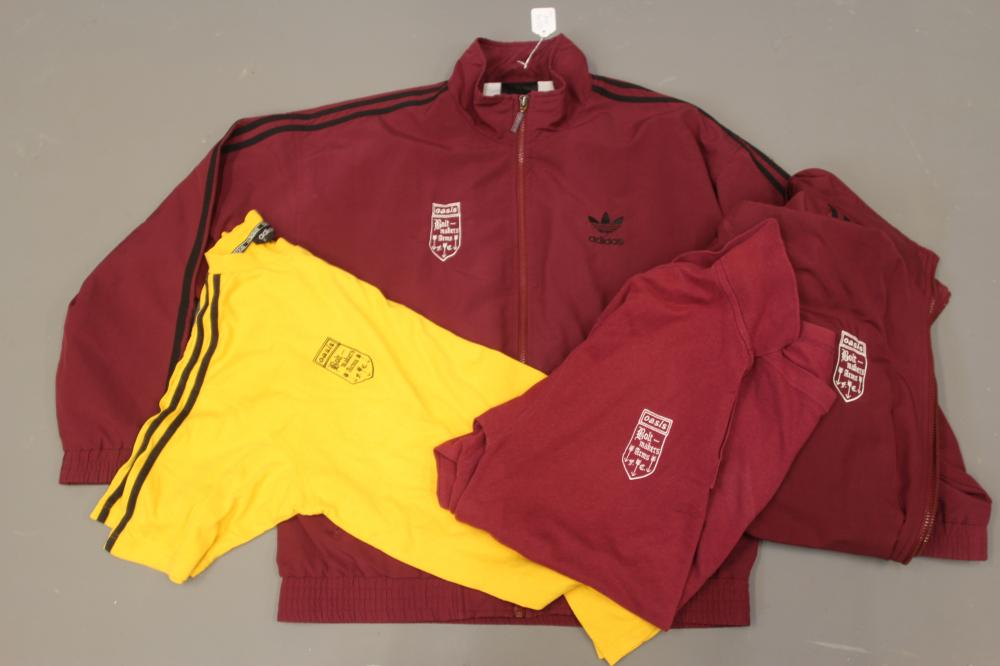 A BESPOKE ADIDAS BOLT MAKERS ARMS PUB FOOTBALL TEAM SPORTS KIT comprising of a maroon tracksuit top Image