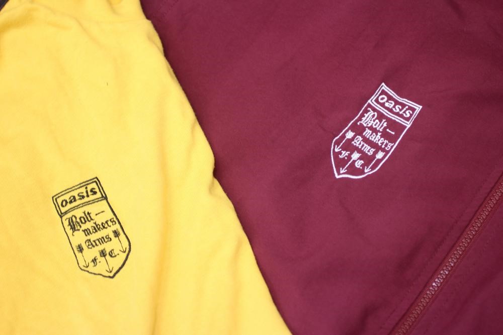 A BESPOKE ADIDAS BOLT MAKERS ARMS PUB FOOTBALL TEAM SPORTS KIT comprising of a maroon tracksuit top Image