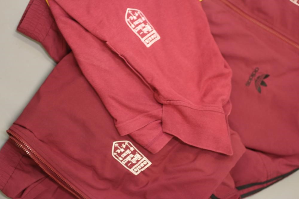 A BESPOKE ADIDAS BOLT MAKERS ARMS PUB FOOTBALL TEAM SPORTS KIT comprising of a maroon tracksuit top Image